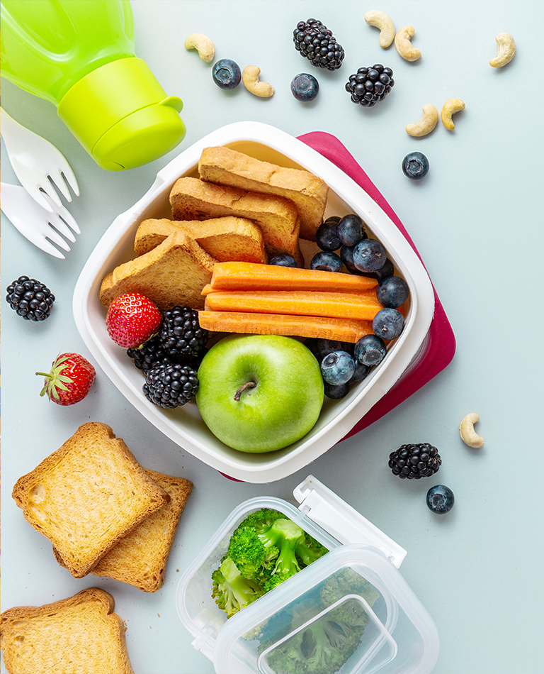1A-assorted fruits, vegetables and crackers in a container.png